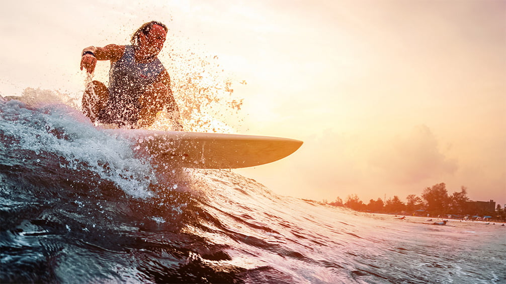 Surfer at sunrise