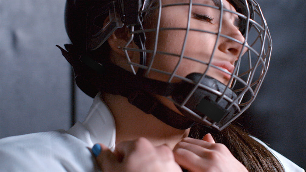 Woman in hockey gear