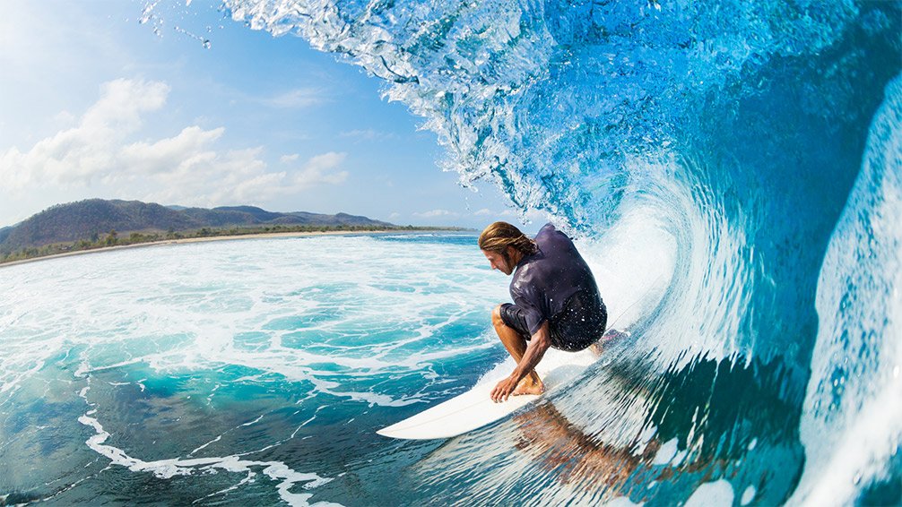 Man riding surfboard