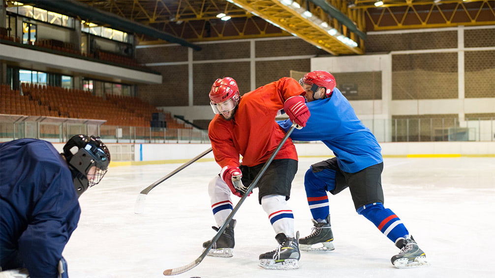 Men playing hockey