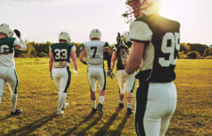 Football players walking onto field